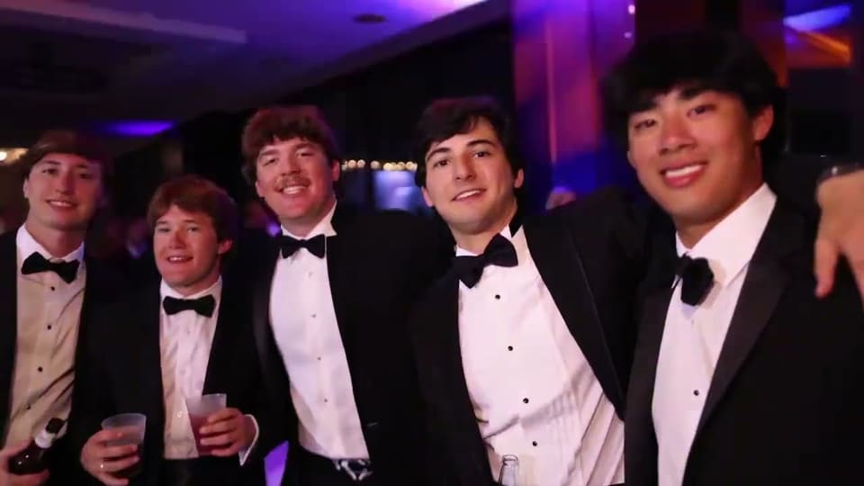 Five friends in tuxedos at a black-tie formal